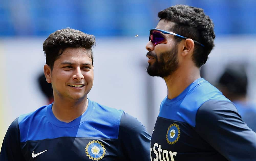 Ravindra Jadeja with newcomer Kuldeep Yadav during the practice session for the first ODI match against West Indies at Jawaharlal Nehru Stadium in Kochi.