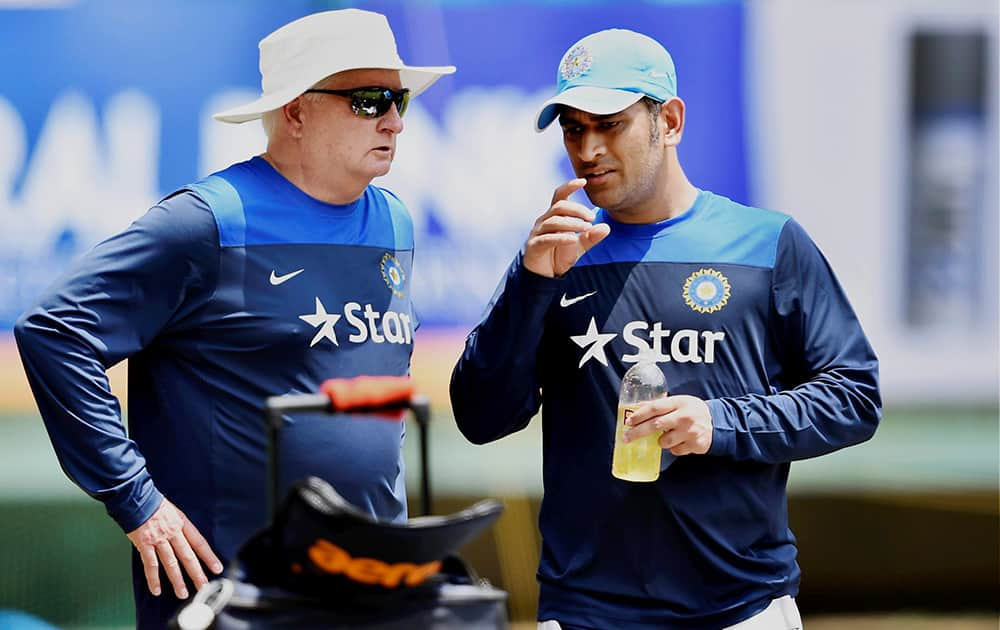 MS Dhoni with coach Duncan Fletcher during the practice session for the first ODI match against West Indies at Jawaharlal Nehru Stadium in Kochi.