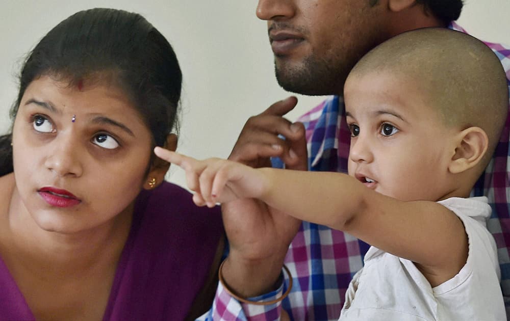 3yr-old Jahnvi with her mother at a press conference in New Delhi on Tuesday. Jahnvi, who went missing from India Gate last week was found in West Delhis Janakpuri area.