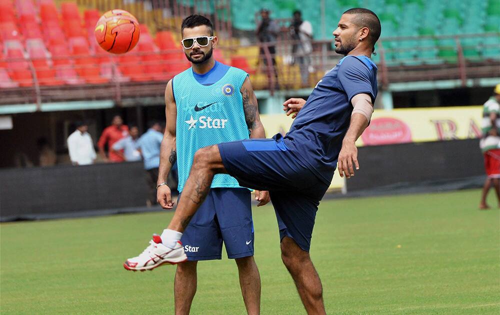 Virat Kohli and Shikhar Dhavan during a practice session ahead of the first ODI match against West Indies at Kochi International Stadium.