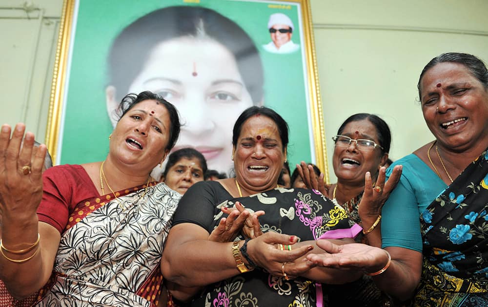 Supporters of AIADMK Supremo J Jayalalitha weep after her conditional bail was rejected by the Bangalore court, in Coimbatore.