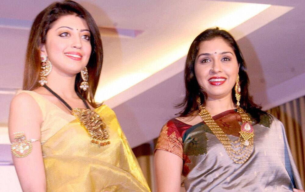 Brand ambassadors of 16th Jewels of India, South Indian actress Pranitha Subhash and Kannada actress Anu Prabhakar walk down the ramp during a jewellery exhibition in Bengaluru.