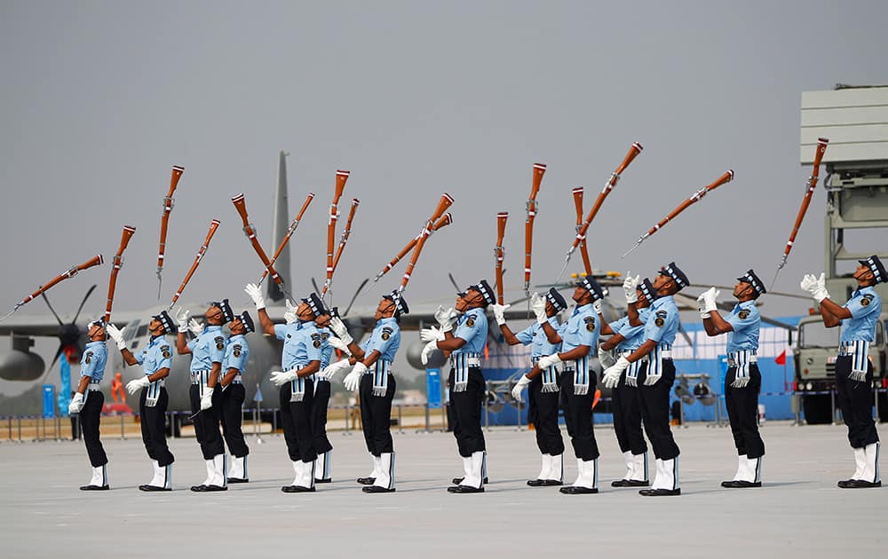 Indian Air Force (IAF) Air Warrior drill team display rifle handling skills during Air Force Day at the air force station in Hindon near New Delhi.