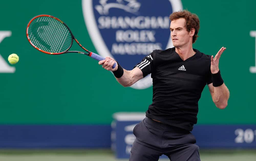 Andy Murray of Britain returns a shot against Jerzy Janowicz of Poland during their men's singles second round match at the Shanghai Masters Tennis Tournament in Shanghai, China.