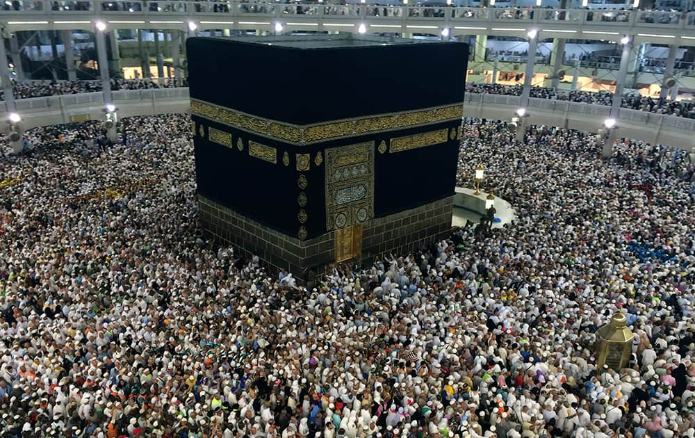 Muslim pilgrims circle the Kaaba, the black cube at center, inside the Grand Mosque during the annual pilgrimage, known as the hajj, in the Muslim holy city of Mecca, Saudi Arabia.