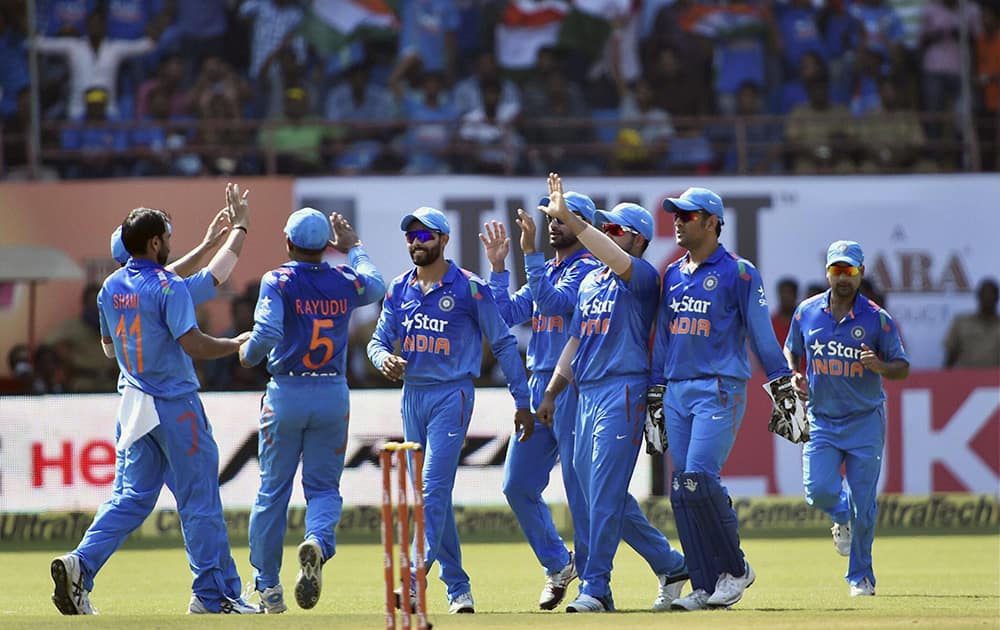 Indian players celebrating the wicket of West Indies Captain Dwayne Bravo during their first ODI match at Jawaharlal Nehru Stadium in Kochi.