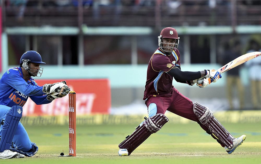 West Indies cricketer Marlon Samuels plays a shot against India during their first ODI match at Jawaharlal Nehru Stadium in Kochi.