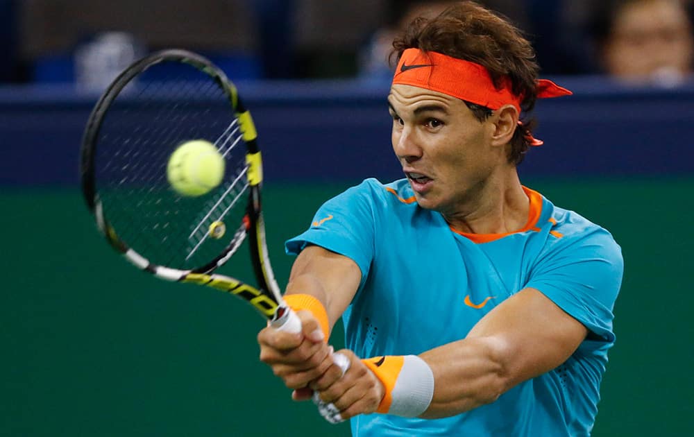 Rafael Nadal of Spain returns a shot to Feliciano Lopez of Spain during their men's singles second round match at the Shanghai Masters Tennis Tournament in Shanghai, China.