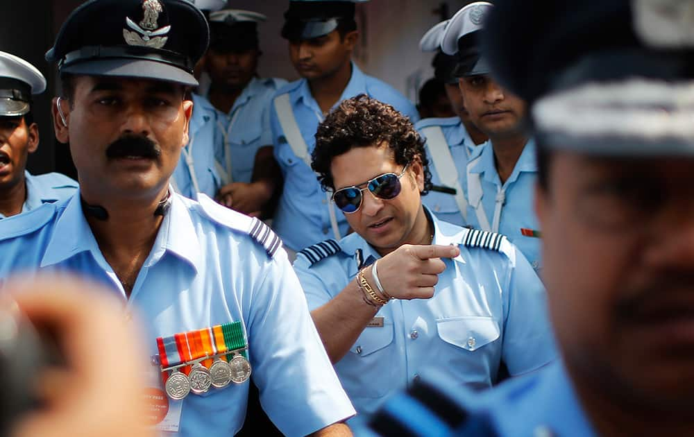 Former Indian cricketer and honorary Indian Air Force Group Captain Sachin Tendulkar, leaves after an Air Force Day parade at the air force station in Hindon near New Delhi.