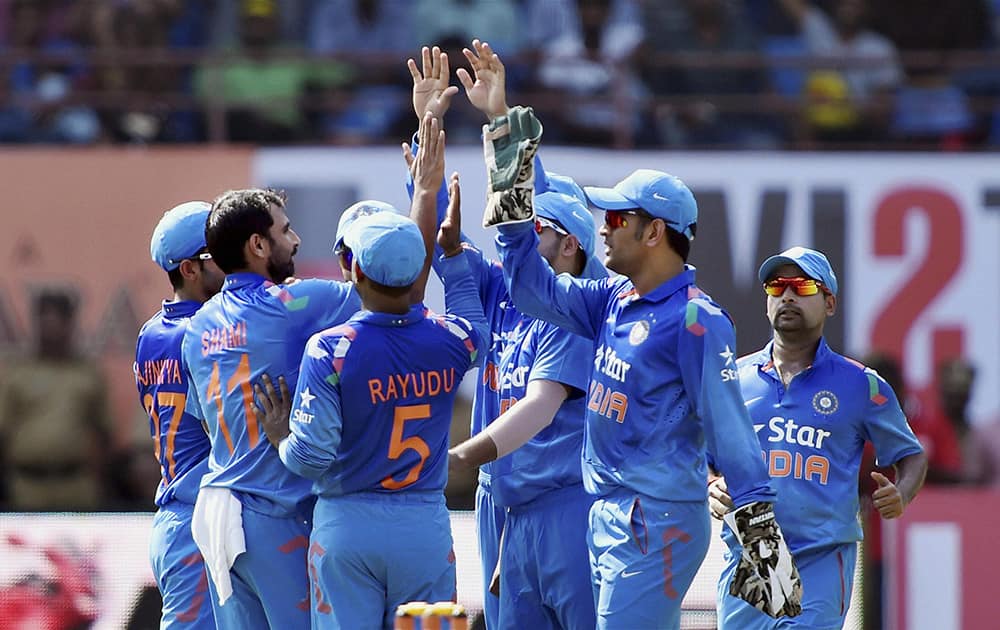 Indian players celebrating the wicket of West Indies Captain Dwayne Bravo during their first ODI match at Jawaharlal Nehru Stadium in Kochi.