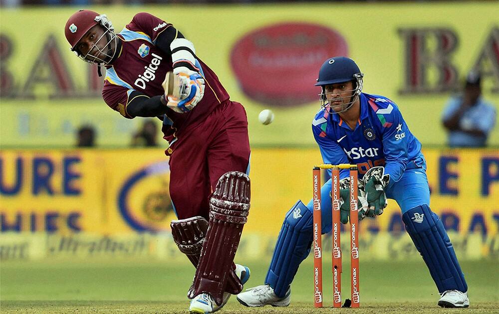 West Indies cricketer Marlon Samuels plays a shot against India during their first ODI match at Jawaharlal Nehru Stadium in Kochi.