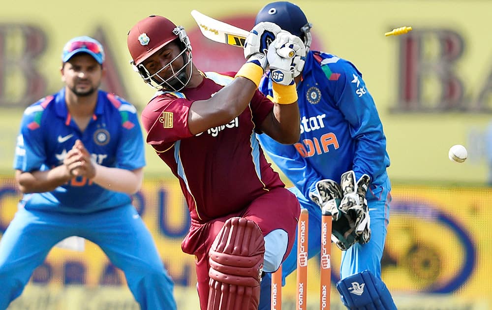 West Indies Cricketer Dwayne Smith is bowled out by Indias Ravindra Jadeja during their first ODI match at Jawaharlal Nehru Stadium in Kochi.