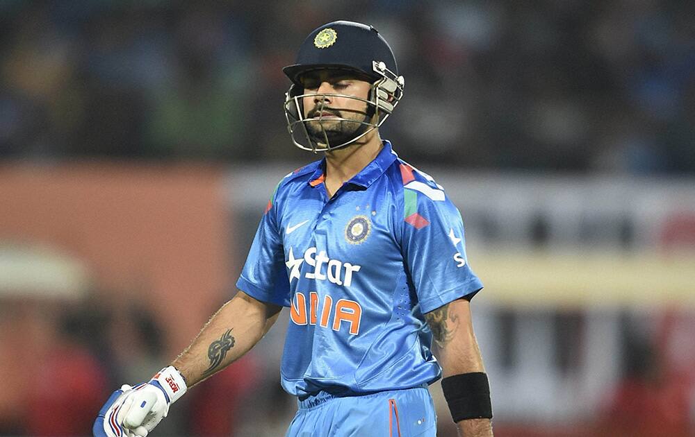 Virat Kohli walks back after getting out against West Indies during the first ODI match at Jawaharlal Nehru Stadium in Kochi.