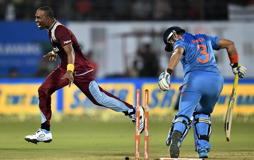 West Indies cricket team captain Dwayne Bravo celebrating for the wicket of Indias Suresh Raina during the first ODI match at Jawaharlal Nehru Stadium in Kochi.