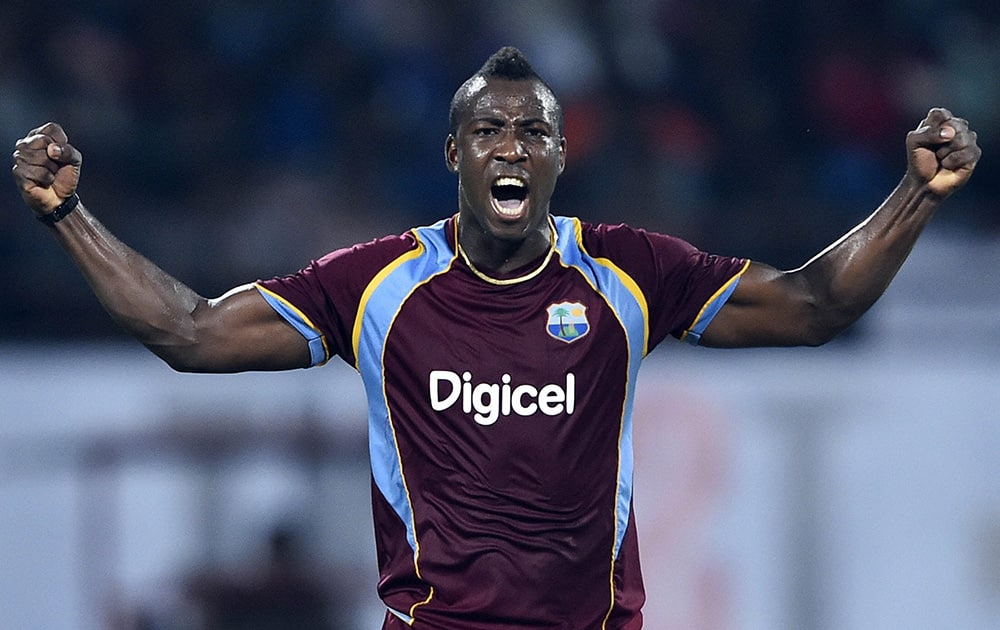 West Indies cricketer Andre Russell celebrating for the wicket of Indias Ambati Rayudu during the first ODI match at Jawaharlal Nehru Stadium in Kochi.