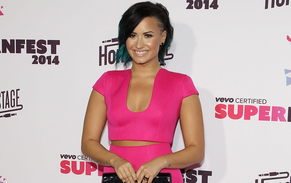 Demi Lovato arrives at the Vevo Certified SuperFanFest Live Concert at the Barker Hangar, in Santa Monica, Calif.