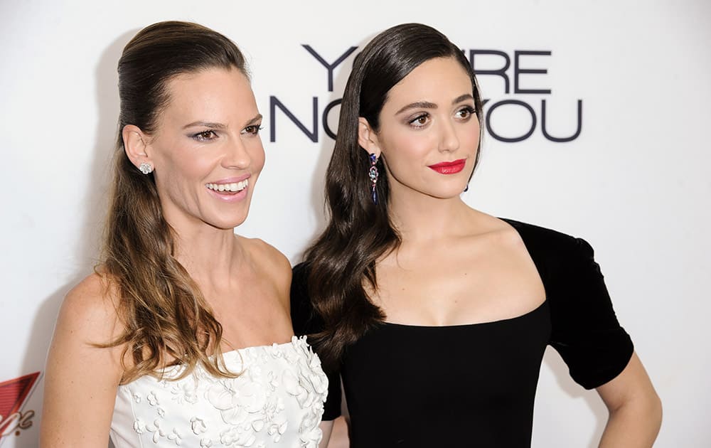 Hilary Swank, left, and Emmy Rossum arrive at the LA Premiere Of 'You're Not You', in Los Angeles. 