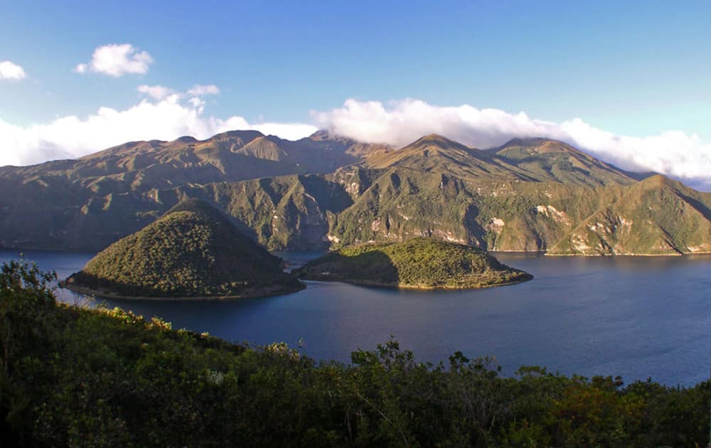 Above: Cuicocha, a caldera and crater lake at the foothills of Cotacachi Volcano. Throughout the Andes mountain range, you will find impressive plateaus, lakes, rivers, waterfalls, hot springs, cloud forests, valleys, indigenous markets and picturesque villages, and historical and modern colonial cities.