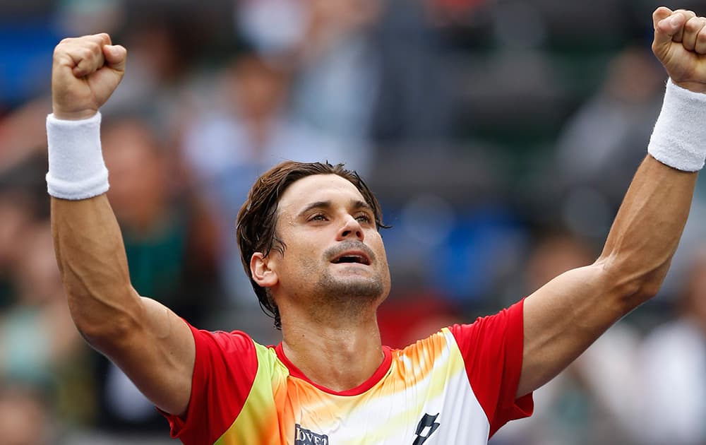 David Ferrer of Spain celebrates after beating Andy Murray of Britain during their men's singles third round match at the Shanghai Masters Tennis Tournament in Shanghai, China.