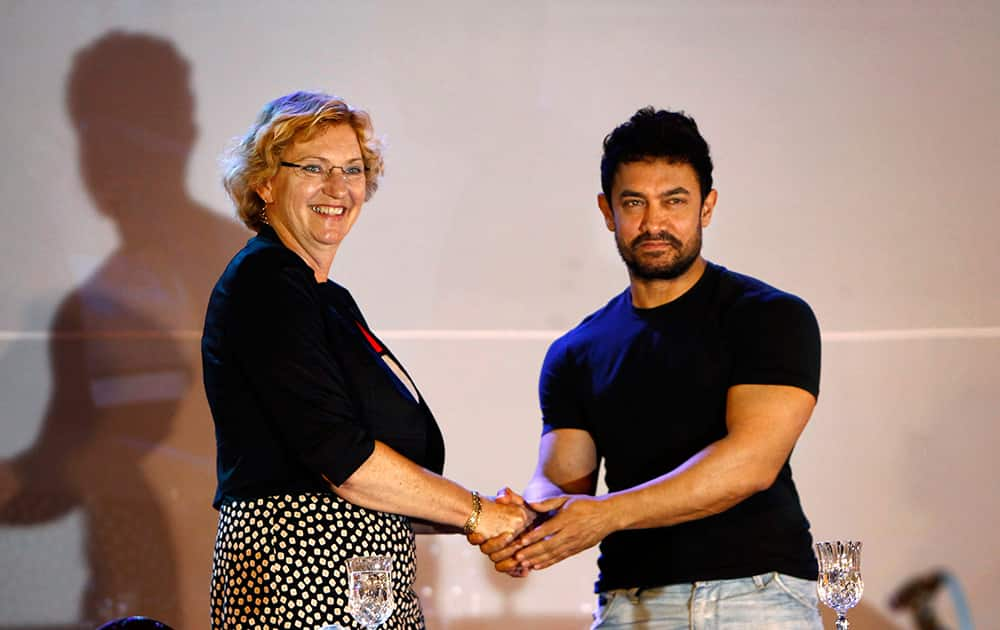 Aamir Khan and UNICEF Regional Director for South Asia Karin Hulshof pose for photographers after UNICEF appointed him as regional Goodwill Ambassador for nutrition, in Katmandu, Nepal.