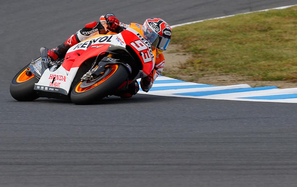 Spain's rider Marc Marquez steers his Honda during free practice ahead of Sunday's Japanese Grand Prix at Twin Ring Motegi circuit in Motegi, north of Tokyo.