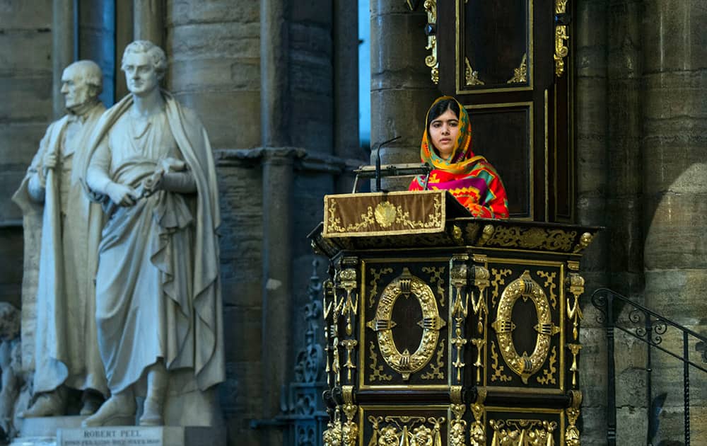File Photo: Pakistani school girl education advocate Malala Yousafzai gives a speech as she attends the Commonwealth Observance day multi-faith celebrations at Westminster Abbey, London. Teenage activist Malala Yousafzai has jointly won the Nobel Peace Prize for her 'heroic struggle' for girls' rights to education, it is announced Friday Oct. 10, 2014.