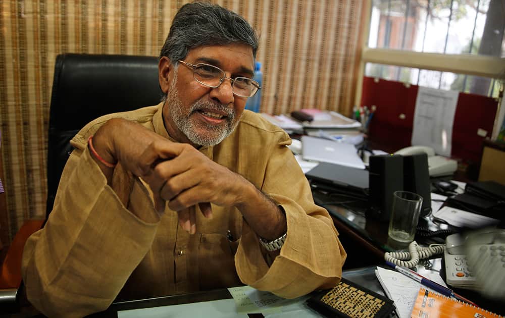 Indian children's rights activist Kailash Satyarthi addresses the media at his office in New Delhi. Malala Yousafzai of Pakistan and Satyarthi of India jointly won the Nobel Peace Prize for risking their lives to fight for children's rights.