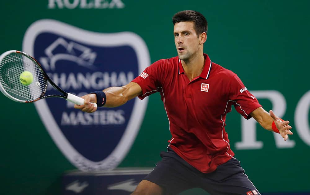 Novak Djokovic of Serbia returns a shot against David Ferrer of Spain during their men's singles quarterfinal match of Shanghai Masters Tennis Tournament in Shanghai, China.