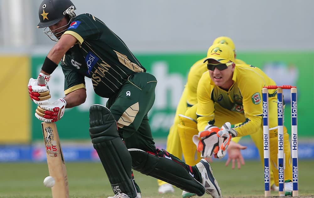 Pakistani batsman Ahmed Shehzad hits the ball during the second one day international match between Australia and Pakistan in Dubai, United Arab Emirates.