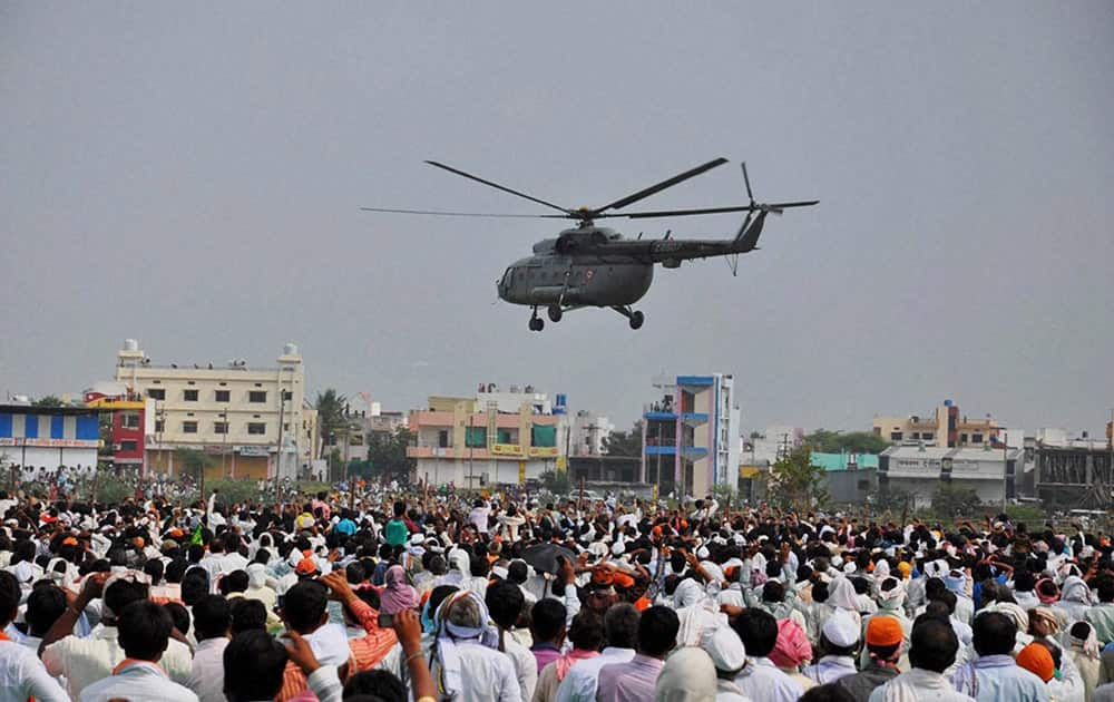 Prime Minister Narendra Modi leaves after an election campaign rally in Hingoli.