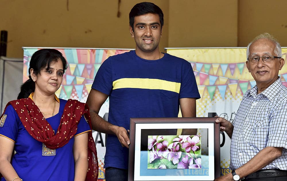 Cricketer R Ashwin is presented with a portrait at a programme where he was made the Goodwill Ambassador of the Madras Dyslexia Association in Chennai.