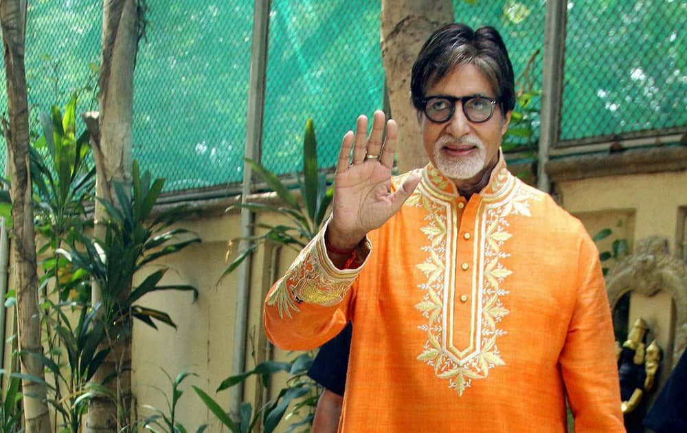 Bollywood mega star Amitabh Bachchan gestures while celebrating his 72nd birthday with the media at his office Janak in Mumbai.