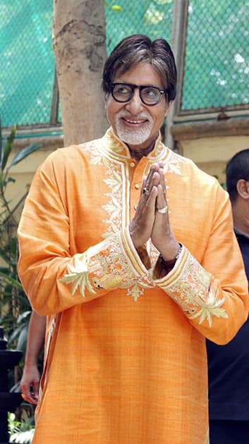 Bollywood mega star Amitabh Bachchan gestures while celebrating his 72nd birthday with the media at his office Janak in Mumbai.