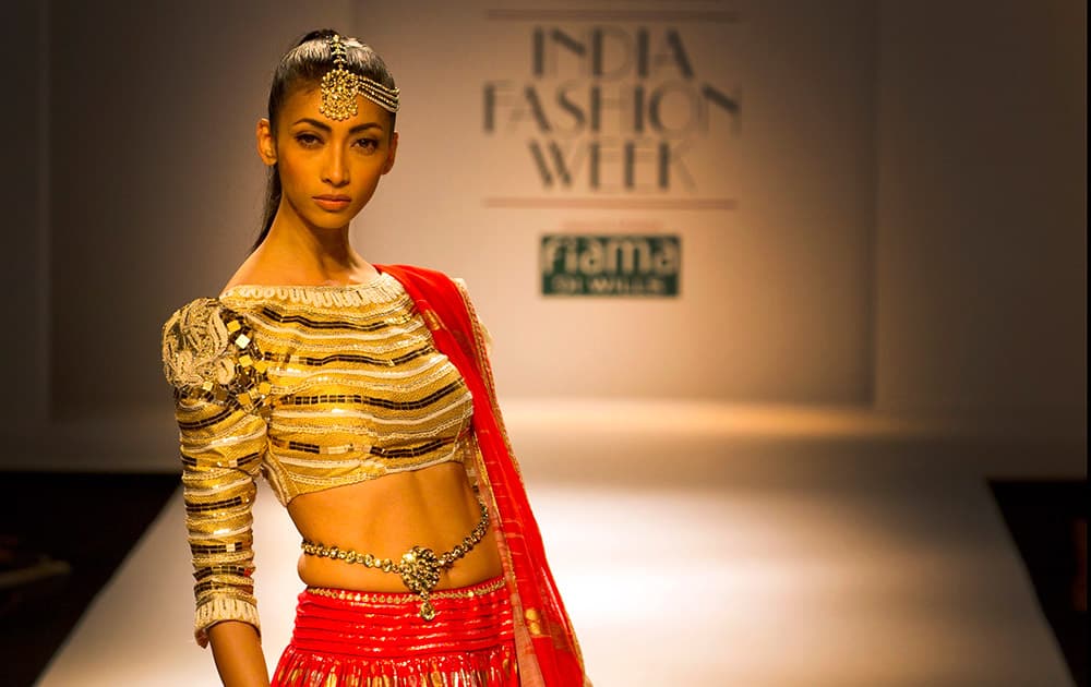 An Indian model displays a creation by designer Poonam Dubey during Wills Lifestyle India Fashion Week, in New Delhi.