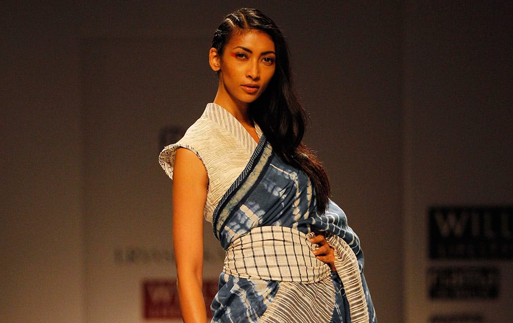 An Indian model displays a creation by designer Urvashi Kaur during Wills Lifestyle India Fashion Week, in New Delhi.