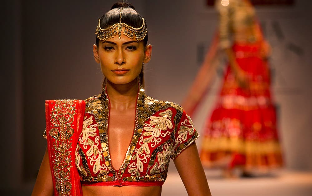 An Indian model displays a creation by designer Poonam Dubey during Wills Lifestyle India Fashion Week, in New Delhi.