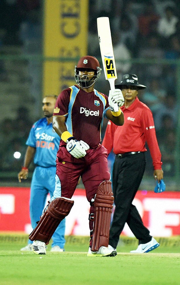 West Indies D Smith celebrates fifty against India during the 2nd ODI cricket match in New Delhi.