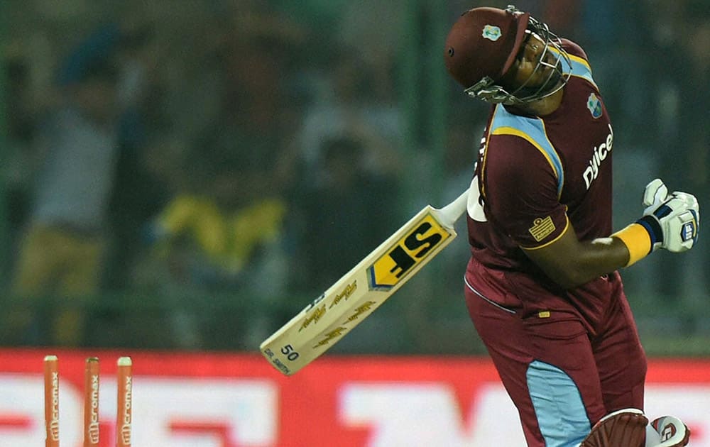 West Indies D Smith reacts after bowled by Indias M Shami during the 2nd ODI cricket match in New Delhi.