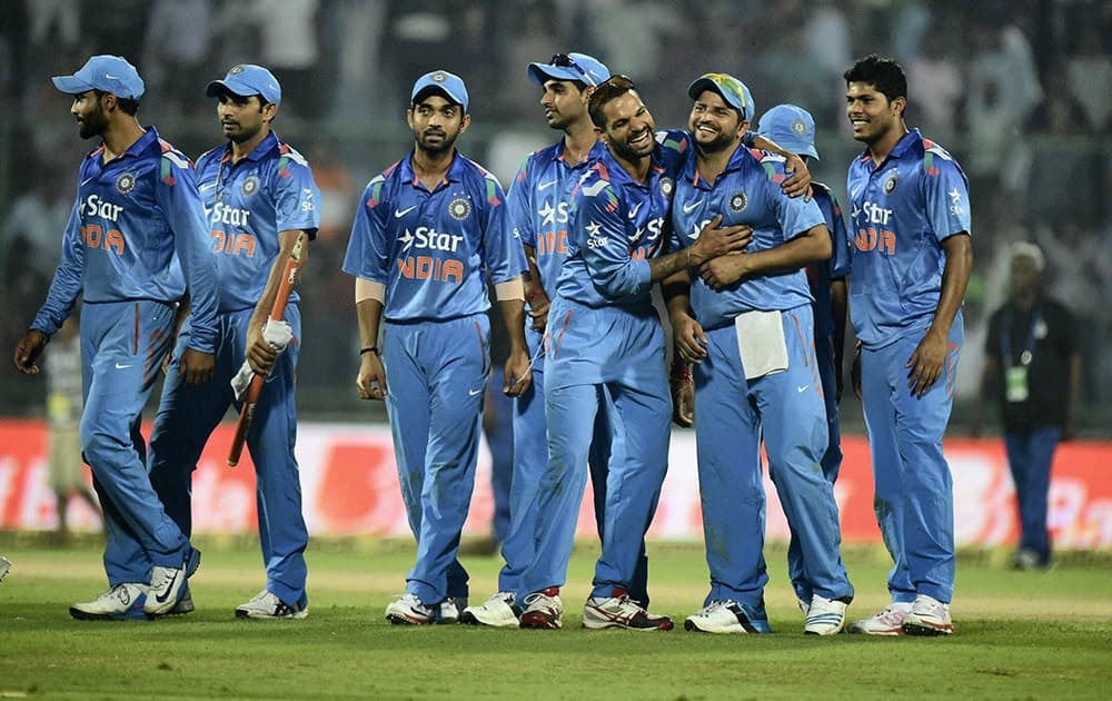  Indian cricketers celebrate after winning the 2nd ODI against West Indies in New Delhi.