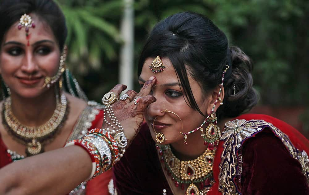 Indian Hindu married women perform rituals on Karva Chauth festival in Ahmadabad, India.