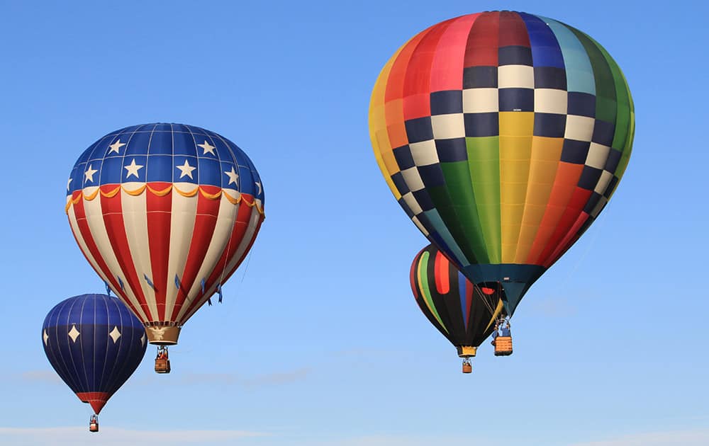 Hot air balloons lift off during the mass ascension at the annual Albuquerque International Balloon Fiesta in Albuquerque, N.M.