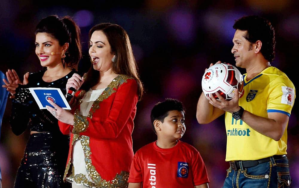 ISL Founding Chairperson Nita Ambani declare the Indian Super League (ISL) 2014 open as cricketer Sachin Tendulkar and bollywood actress Priyanka Chopra look on.
