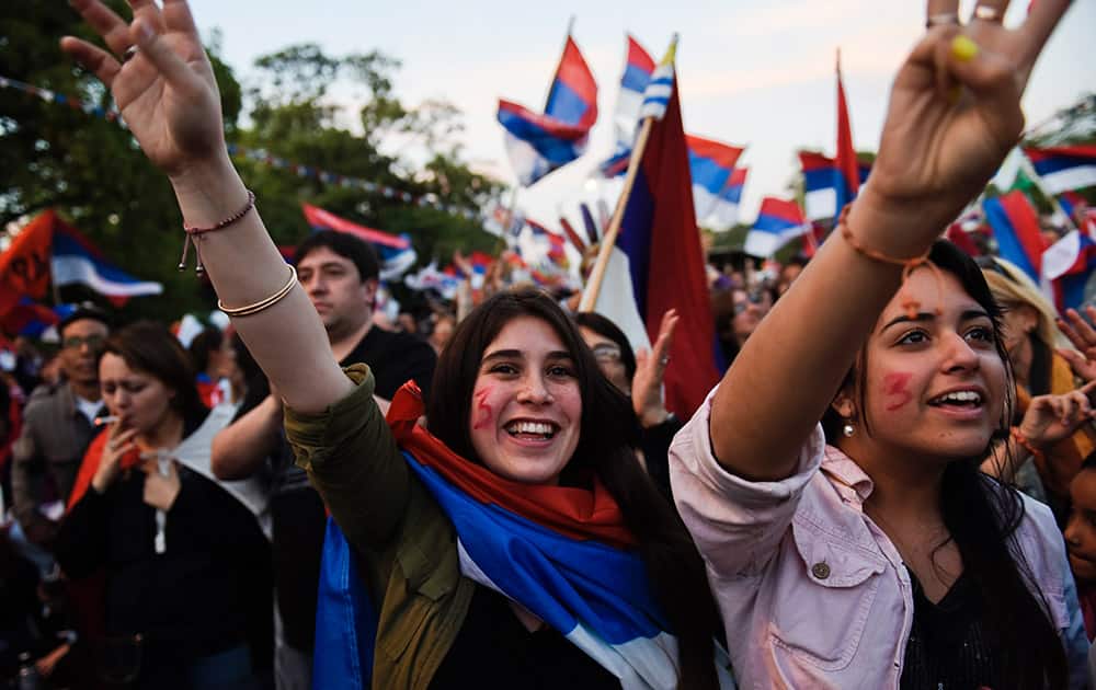 Supporters of presidencial candidate for the ruling Frente Amplio party, Tabare Vazquez, wave during a rally in Montevideo, Uruguay.