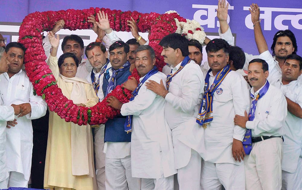 Former Uttar Pradesh Chief Minister and Bahujan Samaj Party supremo, Mayawati being garlanded by party workers during an election rally in Faridabad.