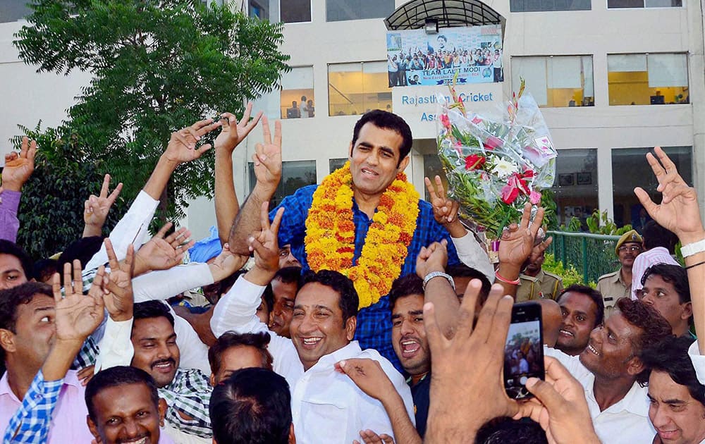 Amin Pathan celebrates with his supporters after taking charge as the President of Rajasthan Cricket Association in Jaipur.