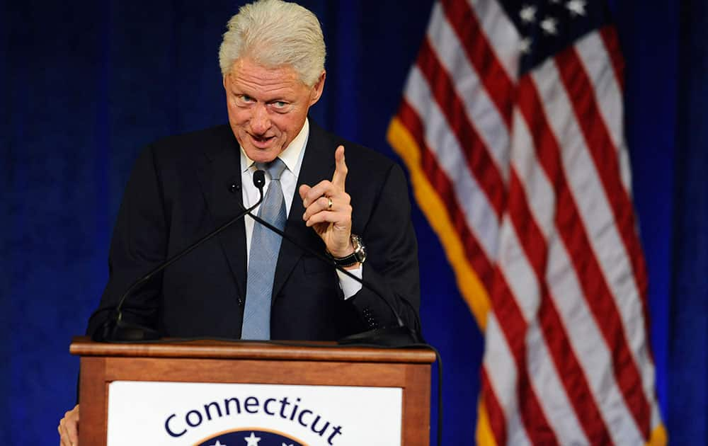 Former President Bill Clinton gestures as he speaks at a rally for Gov. Dannel P. Malloy, in Hartford, Conn.