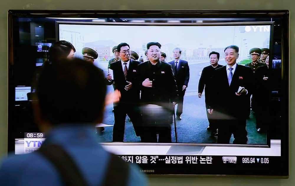 A man watches a TV news program showing North Korean leader Kim Jong Un using a cane during his first public appearance, at the Seoul Railway Station in Seoul, South Korea.