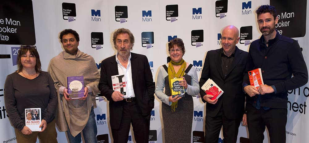 Nominees for the 2014 Man Booker prize for fiction, each holding their book from the left, British author Ali Smith, 'How To Be Both', British author Neel Mukherjee, 'The Lives of Others', British author Howard Jacobson 'J', US author Karen Joy Fowler, 'We Are All Completely Beside Ourselves', Australian author Richard Flanagan, 'The Narrow Road to the Deep North', and US author Joshua Ferris, 'To Rise Again at a Decent Hour', pose for the cameras during a photo call at the Royal Festival Hall in London.