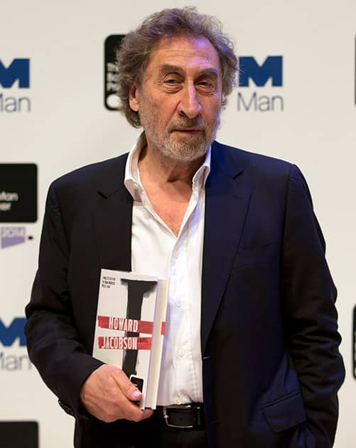 Man Booker prize 2014 nominee British author Howard Jacobson holds his book 'J', during a photocall for the Man Booker Prize for fiction 2014 at the Royal Festival Hall in London.