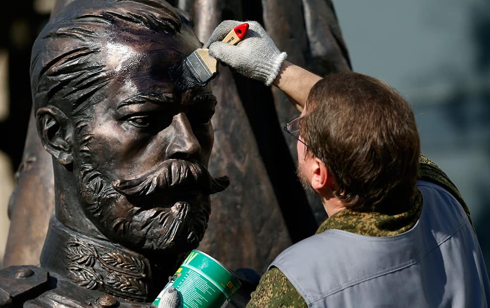 A worker prepares a new statue of Russia's last Czar, Nicholas II, in downtown Belgrade, Serbia. Serbia is preparing to stage a hero's welcome for Russian President Vladimir Putin with the country's first military parade in 30 years - the red carpet reception considered by some in the West as highly inappropriate for the leader accused of warmongering in Ukraine. 